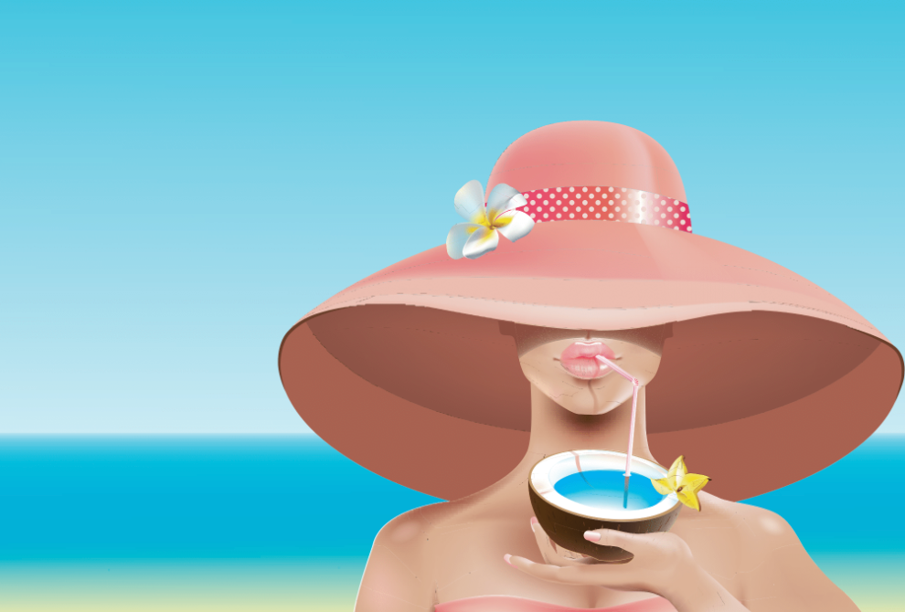 girl sipping a drink on the beach