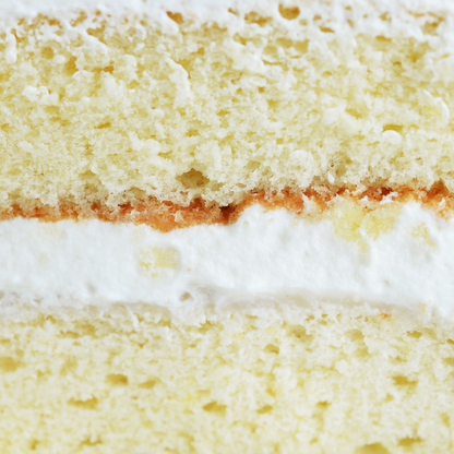 Close-up of a layered cake with white frosting